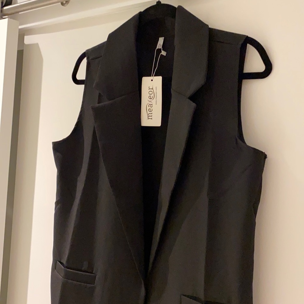 Black sleeveless Blazer vest. Never worn!